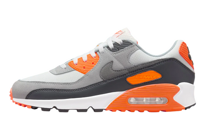 Nike Air Max 90 'Halloween' shoe with white, gray, and orange colors, featuring mesh base layer and prominent orange detailing.