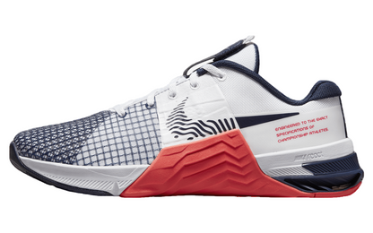 Nike Metcon 8 white sneakers with crimson and obsidian accents, featuring a textured upper and a distinctive sole design.