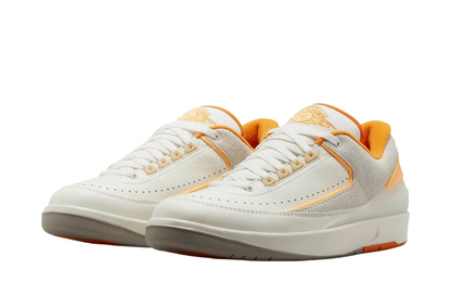 Air Jordan 2 Retro Low Craft Melon Tint shoes highlighting smooth leather upper and retro silhouette.
