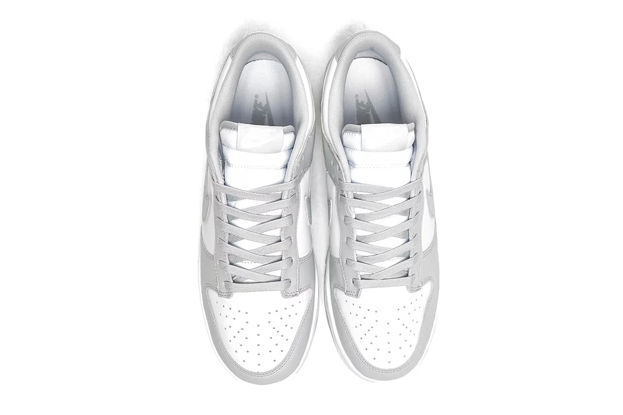 Nike Dunk Low Retro White Grey shoes showing padded tongue and laced upper.