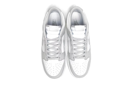 Nike Dunk Low Retro White Grey shoes showing padded tongue and laced upper.