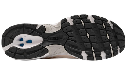 Close-up of a running shoe sole with tread pattern on a white background