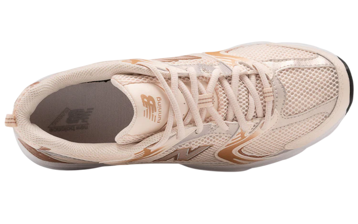 New Balance 530 White Pink shoes highlighting breathable mesh upper and lace design.