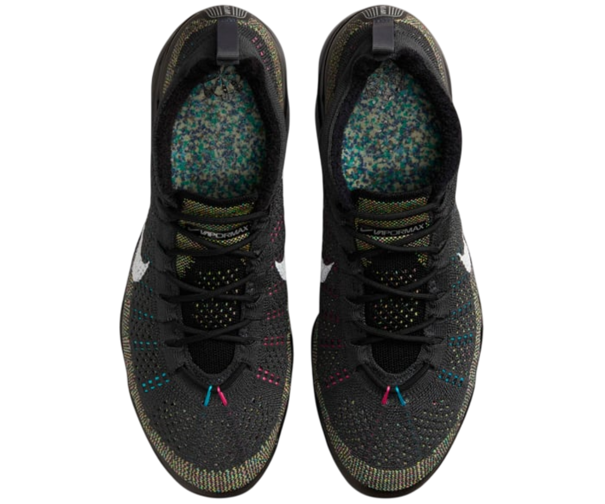 Nike Air Vapormax 2023 Flyknit shoes highlighting woven pattern and lace details.