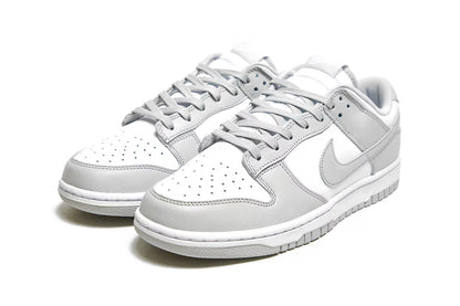 Nike Dunk Low Retro White Grey Fog shoes highlighting swoosh design and classic silhouette.