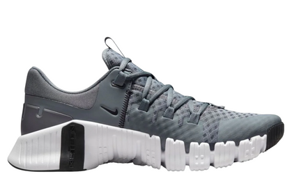 Nike Free Metcon 5 training shoes showing supportive upper and reinforced midsole for stability during workouts.